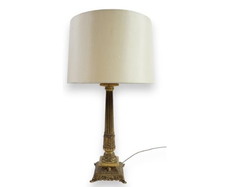A Victorian style brass table lamp of classical form with foliate and mask motifs, 49cm high  A little dusty and oxidised but