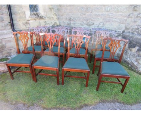 A set of 12 Chippendale design dining chairs
