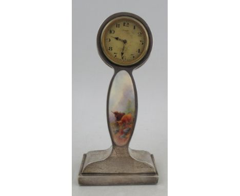 A Royal Worcester hallmarked silver clock, inset with porcelain panel decorated with Highland cattle, signed John Stinton