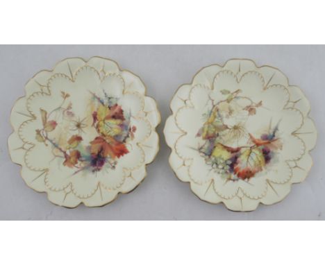Two Royal Worcester shaped plates, decorated with spiders, cobwebs and foliage, to a shaped and moulded leaf border, diameter