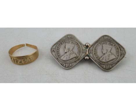 An 18ct gold ring, weight 2.2g, together with a coin brooch