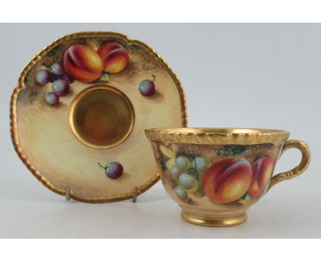 A Royal Worcester tea cup and saucer, decorated with fruit by Roberts&nbsp;Condition Report:  Good condition, no chips, crack