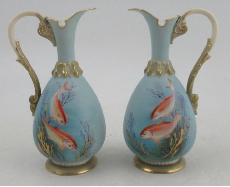 A pair of Royal Worcester ewers, decorated with goldfish, signed H. Davis IT HAS BEEN SUGGESTED THERE MAY BE RESTORATION TO T