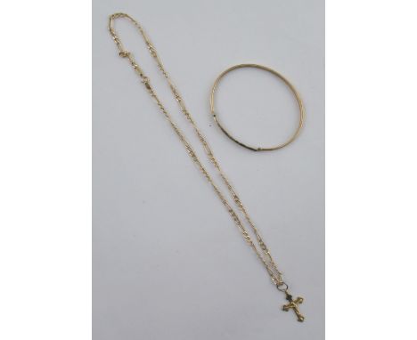 A 9ct gold crucifix, on fine 9ct chain, together with a 9ct bangle, channel set single round brilliant cut diamond, approx. 9
