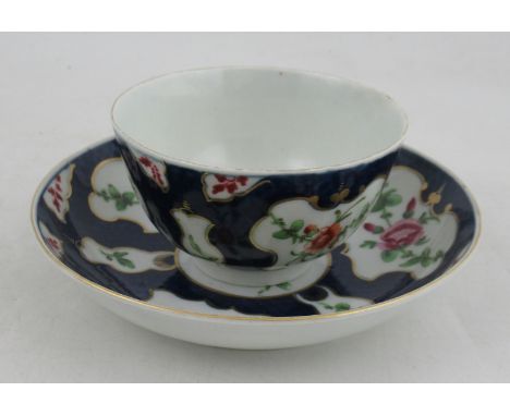 An 18th century Worcester scale blue tea bowl and saucer, with reserved panels of flowers&nbsp;Condition Report:  Both have n