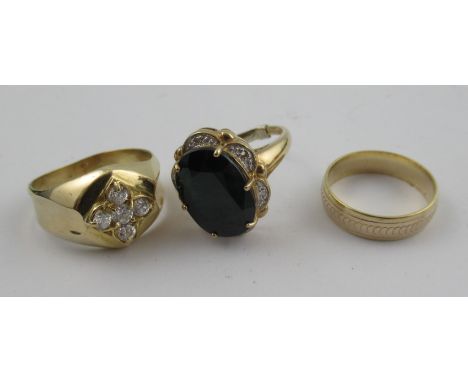 A 9ct sapphire ring, with oval cut sapphire and four diamond highlights, together with a yellow metal ring with cz cluster, s