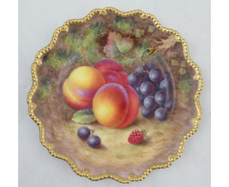 A Royal Worcester cabinet plate, decorated with hand painted fruit signed H Ayrton, with a gilt gadrooned edge, diameter 9ins