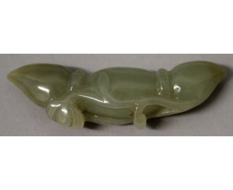 A SMALL CHINESE CELADON JADE CARVING, in the form of entwined lotus buds, 2.9in wide.