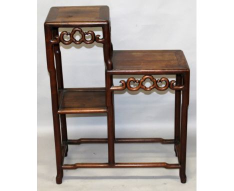 A GOOD QUALITY 19TH CENTURY CHINESE TWO TIER CARVED HARDWOOD STAND, of rectangular section, with scroll friezes and a single 