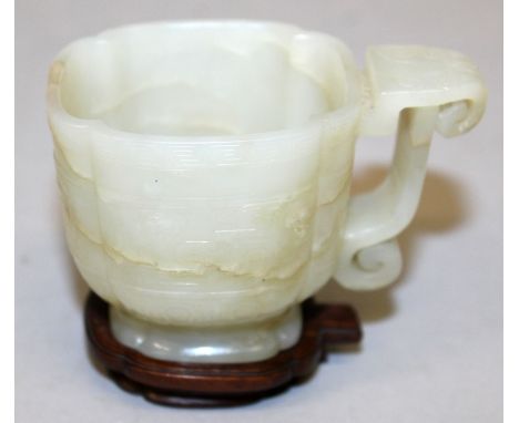 A FINE QUALITY CHINESE PALE CELADON JADE LIBATION CUP, possibly 17th/18th Century, together with a good quality fitted hardwo