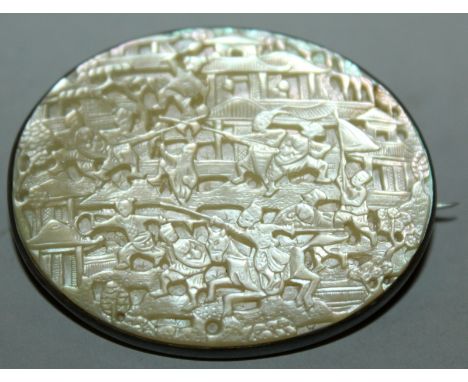 A FINE QUALITY 19TH CENTURY CHINESE MOTHER-OF-PEARL AND SILVER-METAL BROOCH, the metal unmarked, the mother-of-pearl finely c