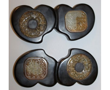 A PAIR OF CHINESE DOUBLE PEACH FORM HARDWOOD PAPERWEIGHTS, each with two jade-like insets, each 7.1in wide.