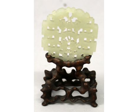 A GOOD QUALITY 19TH/20TH CENTURY CHINESE CARVED & PIERCED CELADON JADE PLAQUE, together with a good quality fitted wood stand