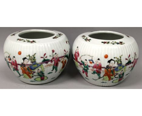 A PAIR OF CHINESE FAMILLE ROSE FLUTED PORCELAIN JARDINIERES, each decorated with scene of a lady and playing boys in a garden