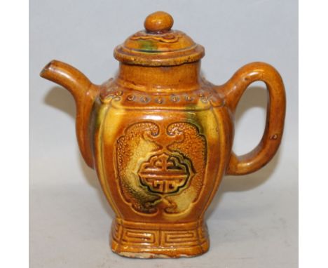 A 17TH/18TH CENTURY CHINESE SANCAI POTTERY TEAPOT & COVER, of rounded square form with fluted corners, the sides moulded in r