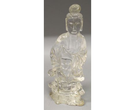 A GOOD EARLY 20TH CENTURY CHINESE ROCK CRYSTAL CARVING OF GUANYIN, the Goddess holding a scroll and dressed in flowing robes,