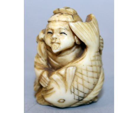 AN EARLY 20TH CENTURY SIGNED JAPANESE IVORY NETSUKE OF EBISU HOLDING THE GIANT CARP, the ivory partially stained, the reverse