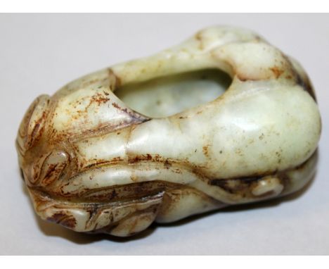 A CHINESE JADE LIKE BRUSHWASHER IN THE FORM OF A SQUASH, with a leafy stem, naturalistically rendered, 3.6in long.