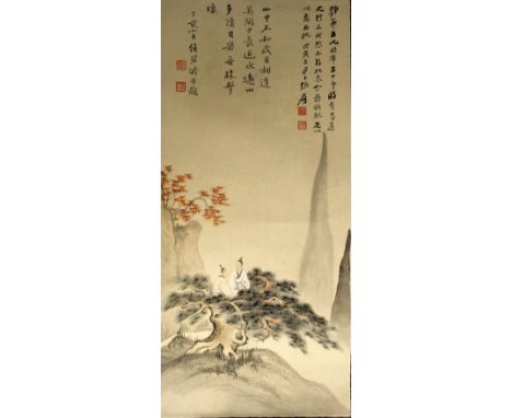 A CHINESE SCROLL PICTURE ON PAPER, within a patterned surround, decorated with calligraphy and with two sages seated on top o