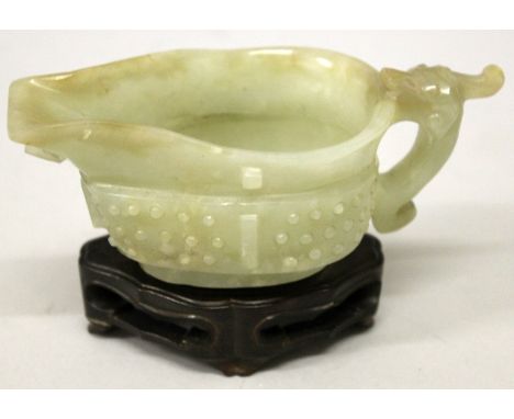 A GOOD QUALITY CHINESE PALE CELADON JADE LIBATION CUP, possibly 17th/18th Century, together with a good quality fitted hardwo