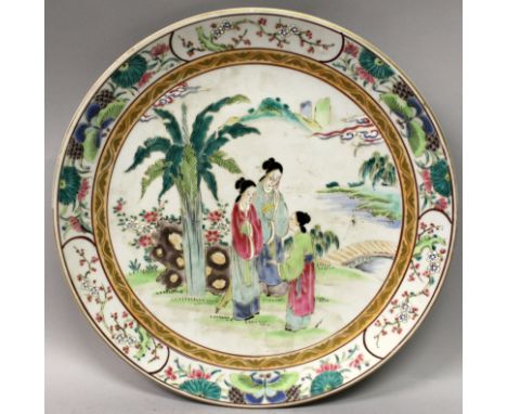 AN EARLY 20TH CENTURY JAPANESE ENAMEL DECORATED PORCELAIN DISH, the base with a maker's mark in blue enamel, 12.3in diameter.