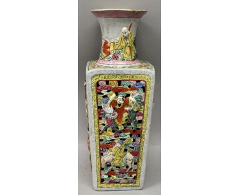 AN EARLY 20TH CENTURY CHINESE PIERCED & MOULDED FAMILLE ROSE PORCELAIN VASE, of square section, the sides decorated in relief