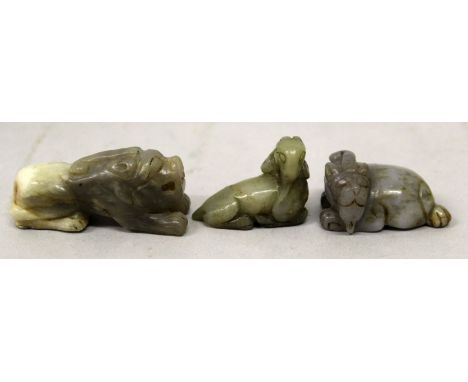 A GROUP OF THREE CHINESE JADE MODELS OF MYTHICAL ANIMALS, the largest 2.2in long. (3)