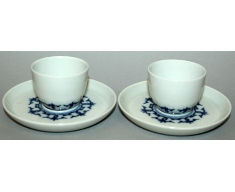 A PAIR OF CHINESE BLUE & WHITE PORCELAIN CUPS & SAUCERS, each piece decorated with a formal linked design, each base with a f
