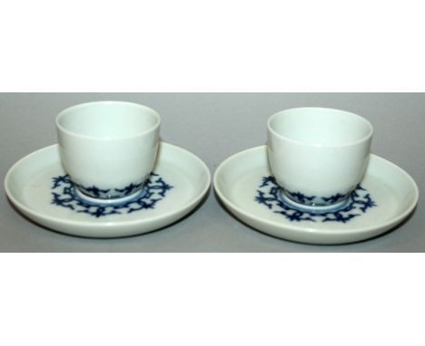 A PAIR OF CHINESE BLUE & WHITE PORCELAIN CUPS & SAUCERS, each piece decorated with a formal linked design, each base with a f