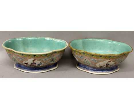 A PAIR OF CHINESE FAMILLE ROSE TONGZHI MARK & PERIOD PINK GROUND PORCELAIN BOWLS, each of quatrefoil section and painted with