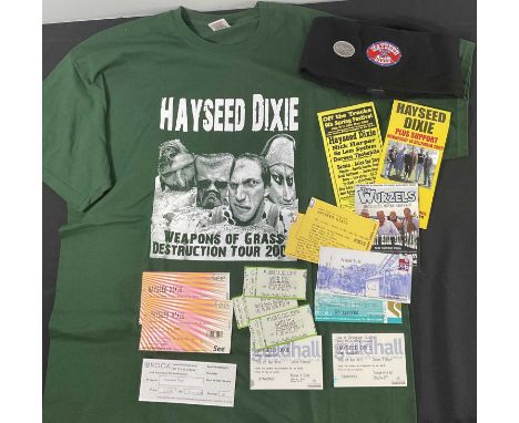 A collection of HAYSEED DIXIE merchandise and memorabilia comprising 12 concert tickets, a men's XL T-shirt, beanie hat and f