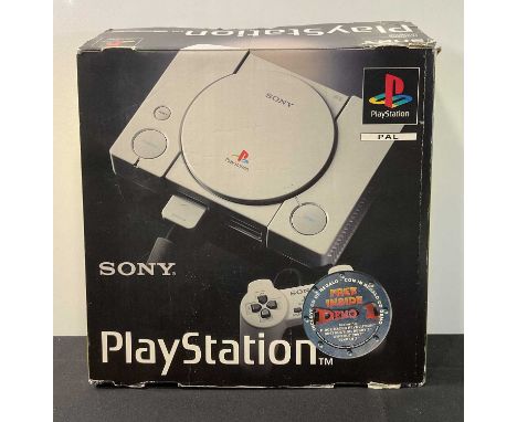 A boxed Sony PLAYSTATION ONE (PS1) console, PAL version, with 2 memory cards and extra cables.