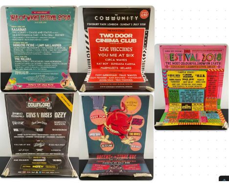 A group of music bus stop festival posters comprising DOWNLOAD Festival (2018), BESTIVAL (2018), QUEENS OF THE STONE AGE AND 