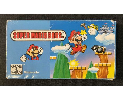 SUPER MARIO BROS Game and Watch Nintendo handheld video game, YM-105, boxed and complete with original inserts, 1988, made in