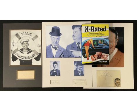 A group of comedian autographs comprising NORMAN WISDOM, LAUREL AND HARDY and SIDNEY JAMES, all mounted in 30cm x 40cm cardbo