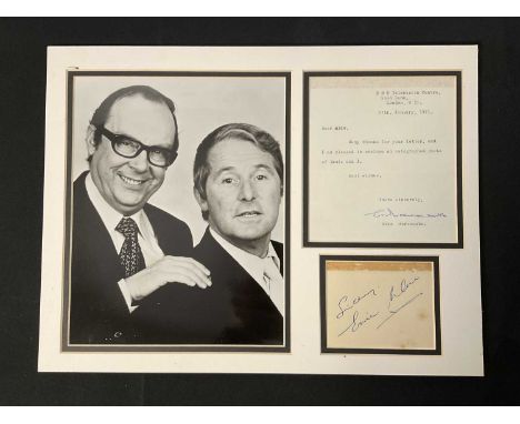 MORECAMBE AND WISE - A cardboard display featuring a piece of paper signed by Ernie Wise and a fan letter response signed by 