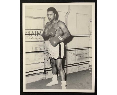 MUHAMMAD ALI - An autographed 8" x 10" black and white still of the boxing legend signed by Muhammad Ali to centre of the ima