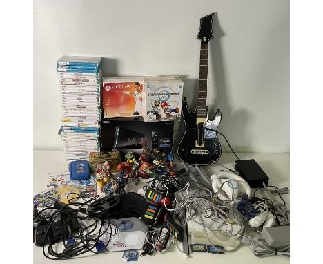 A large collection of retro gaming including Nintendo WII consoles and games, accessories, Disney Infinity characters, and su