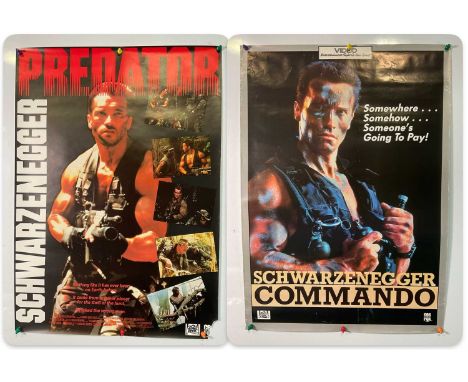 A pair of video shop posters for Schwarzenegger movies comprising PREDATOR (1987) and COMMANDO (1985), rolled (2)