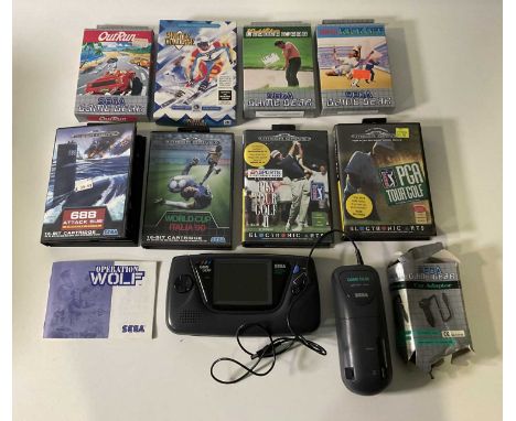 A SEGA GAME GEAR with Battery pack, car adapter and three games, Outrun, Super Kick Off and World Class Leaderboard together 