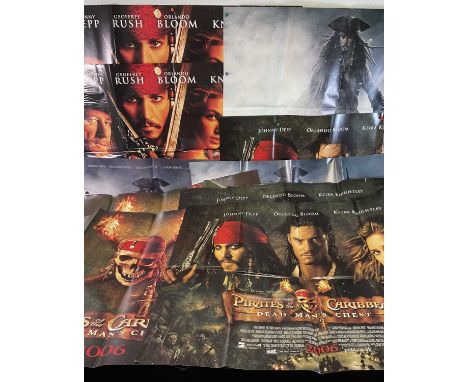 A crew of PIRATES OF THE CARIBBEAN movie posters comprising PIRATES OF THE CARIBBEAN THE CURSE OF THE BLACK PEARL (2003), tea