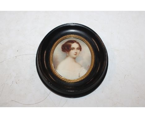A 19th Century miniature hand painted portrait depicting young Queen Victoria in oval ebonised frame, 12.5cm high