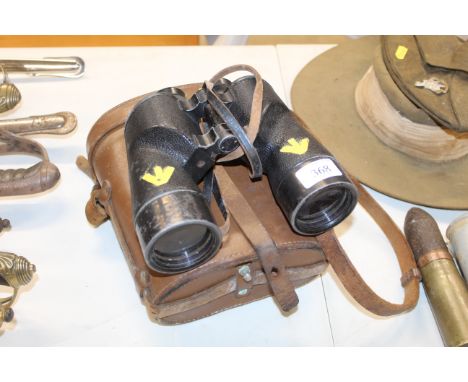 A pair of WWII Canadian made, British Army binoculars in their leather case