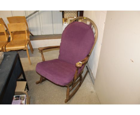A mahogany stick back rocking chair 