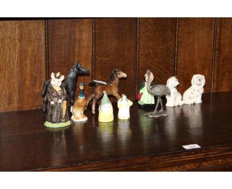 A Beswick figure "Lady Pig"; a Royal Worcester candle snuffer; a Royal Doulton horse; Beswick dogs etc.
