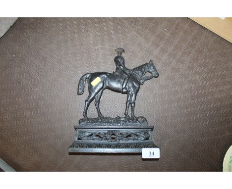 An antique Boer War period cast iron door stop depicting Baden-Powell Astride His Horse