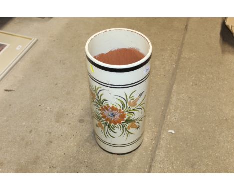A floral painted pottery stick stand 