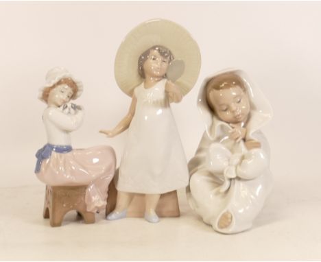 Three Nao Figures to include a Baby in a Blanket, Girl holding a Dog and a Girl in her Mother Clothes. (3) 