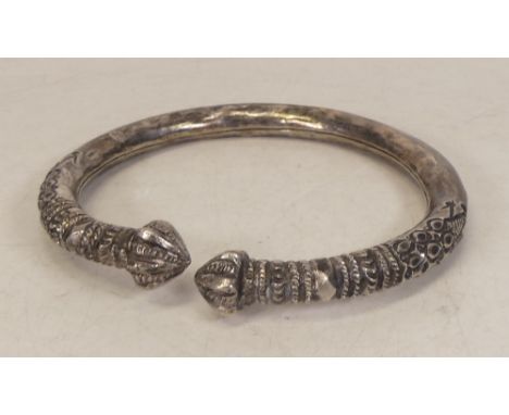 Large silvered metal bangle / armlet of ethnic origin, may be low grade silver or plated. 