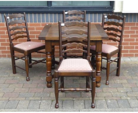 A Heavy Exnteding Dining Table on Turned Legs and X-Stretcher together with Four Modern Ladder Back Upholstered Dining Chairs